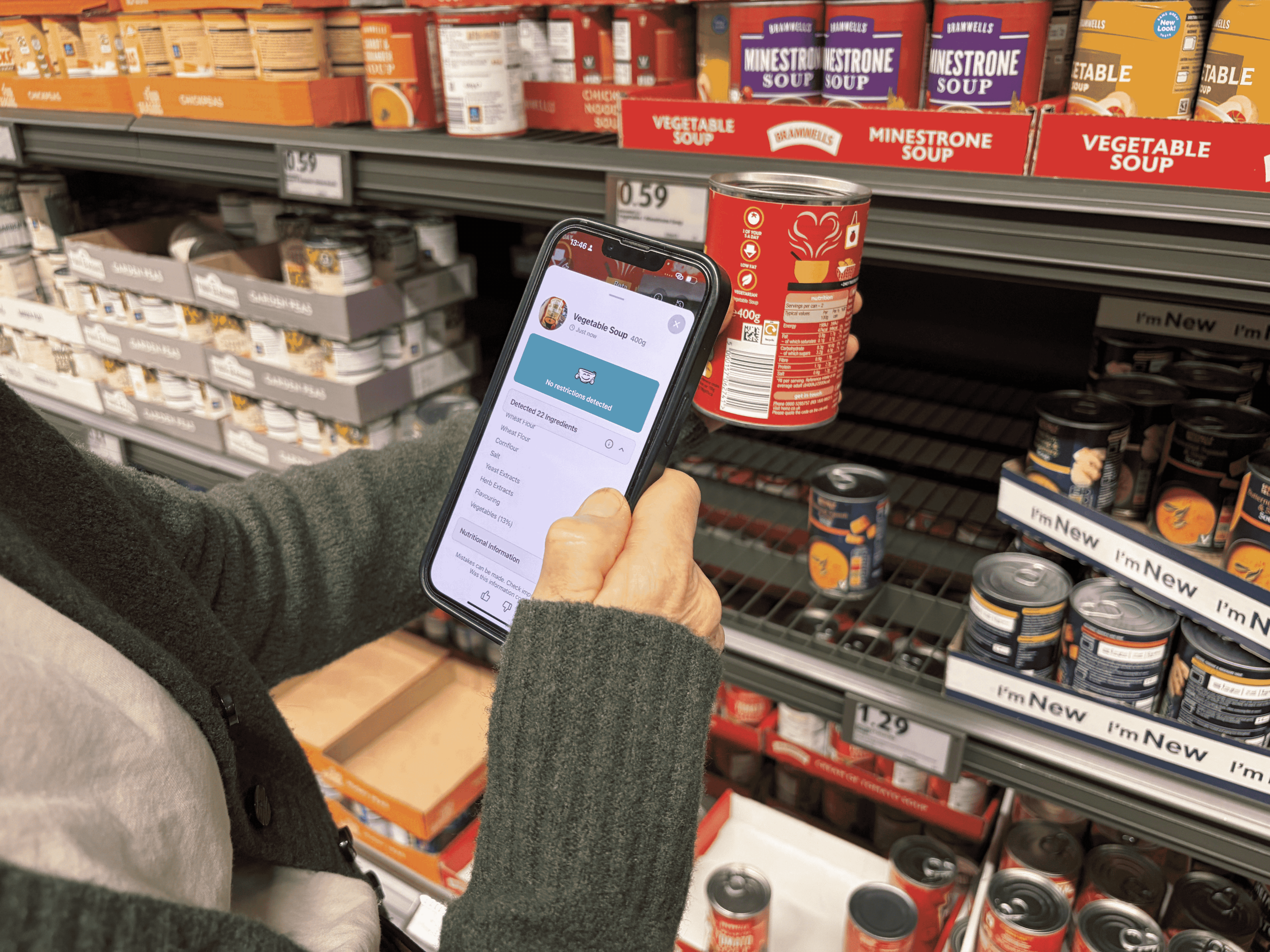 A phone displaying the Freeater shopping app beside food products